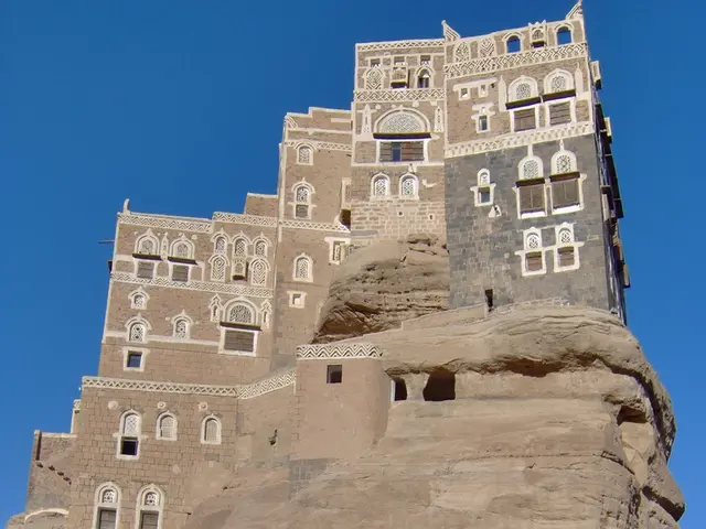 Here we can see a castle. To this castle there are windows and doors. In-front of this castle there...