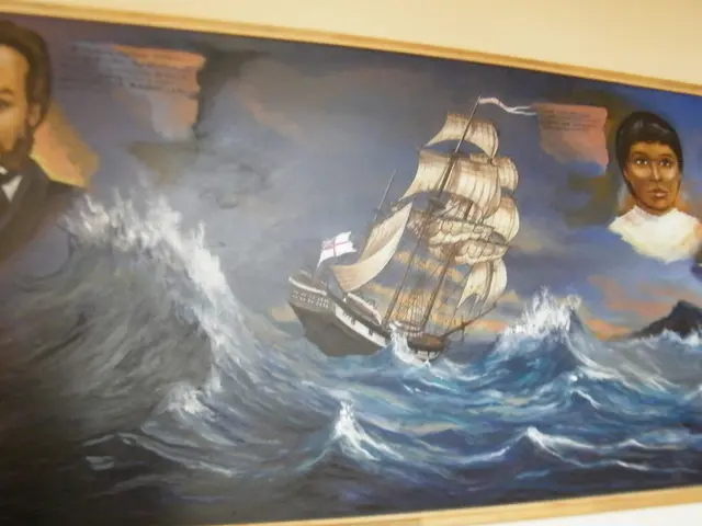 Painting pictures are on the wall. In this picture we can see ship, people and water.